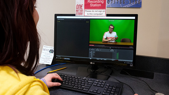 A student editing green screen video in One Button Studio