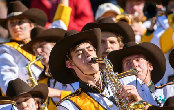 Saxophone player in Western Thunder playing at a football game