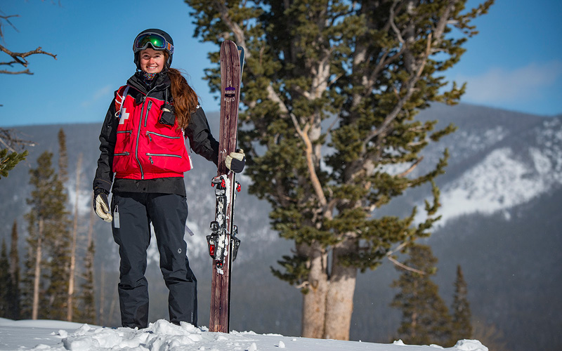 Ski first aid person pictured with skis 