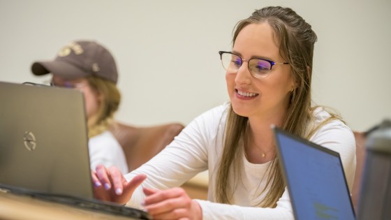 Student on their laptop in class