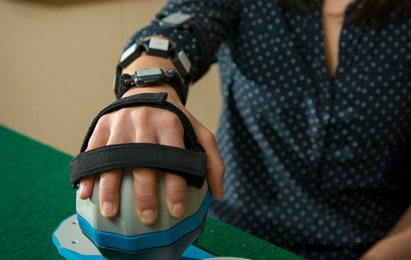 Female student's hand with computer invention