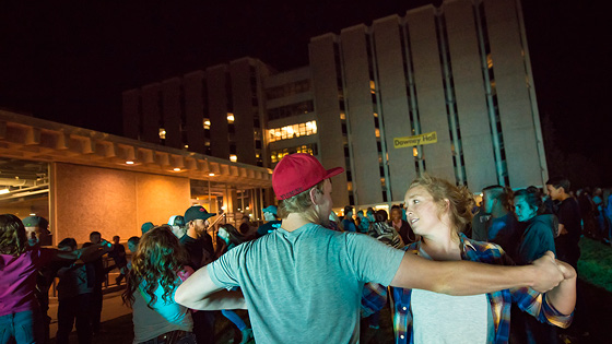 Some Students swing dancing outside of the dorms