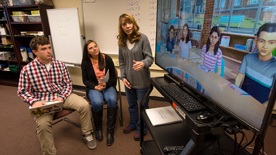 Education students working in a classroom simulation