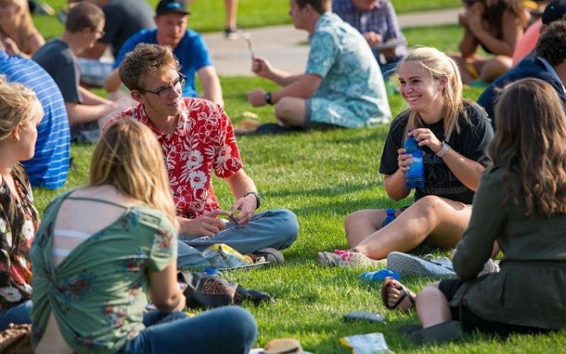 Students sitting in grass