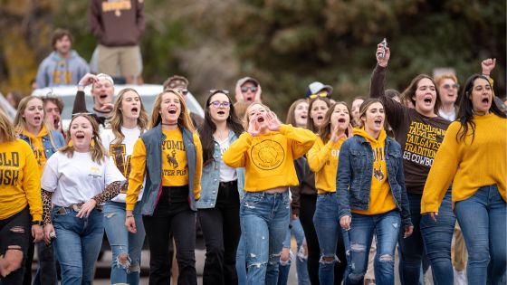 Women's water polo team singing at Homecoming parade