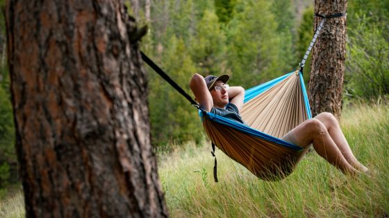 Student relaxing in a hammock