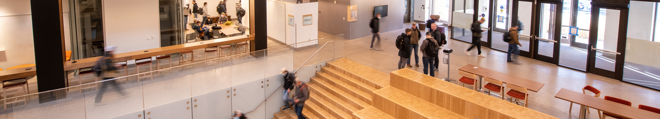 Students walk around the UW Engineering Education and Research building