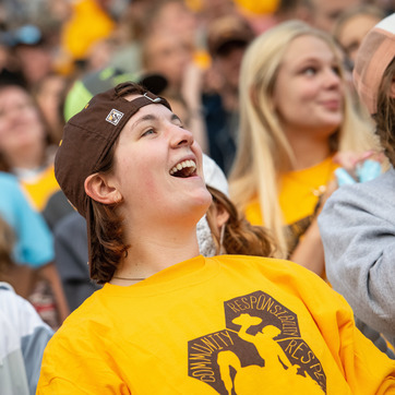 students cheer at a sporting event