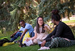 Three UW students enjoy a meal on Prexy’s Pasture.