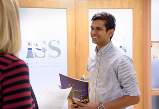 two people outside the iss office