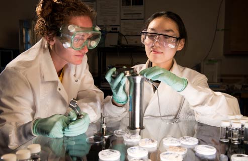 Two students work together in a science lab.