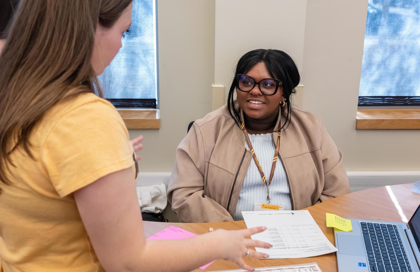 a student works with an advisor