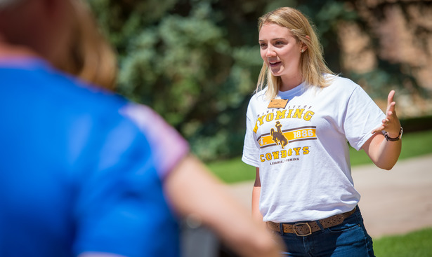 student leader taking a group on a tour