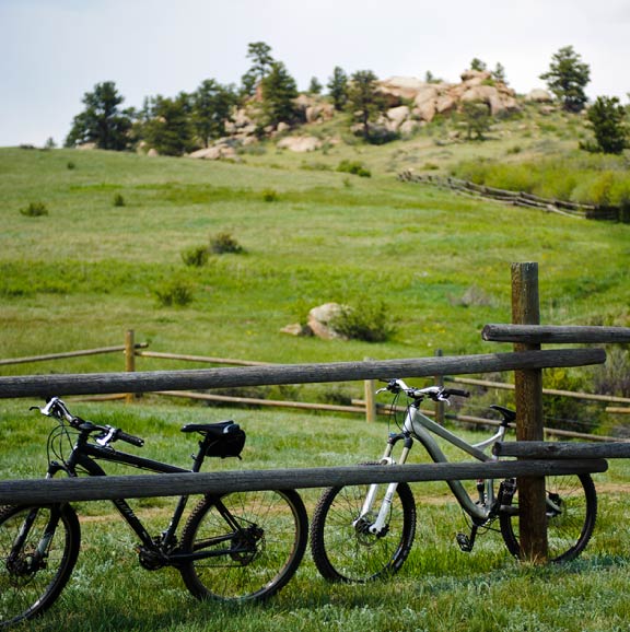 Bikes lean against a fence at Curty Gowdy