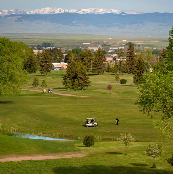 A view of Jacoby Golf Course and Medicine Bow Peak