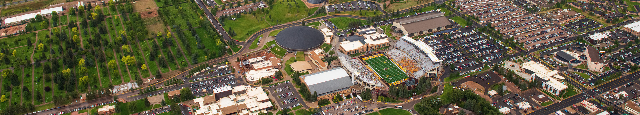 A wide aerial view of UW's campus and the War Memorial Stadium