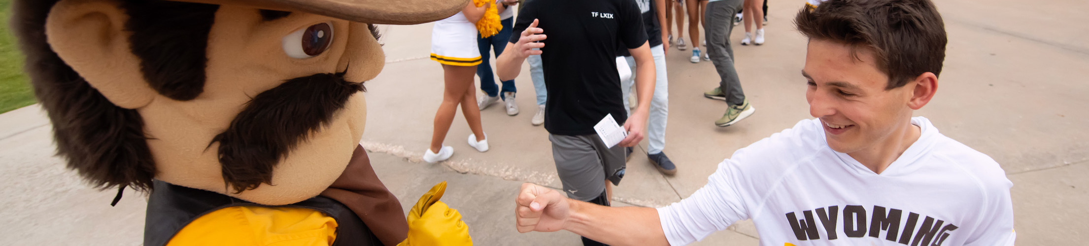 Students receive a t-shirt at an event