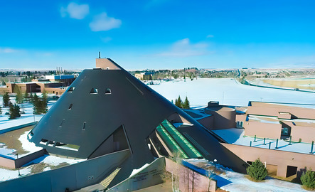 The outside of the UW American Heritage Center for an aerial view with snow on the ground.