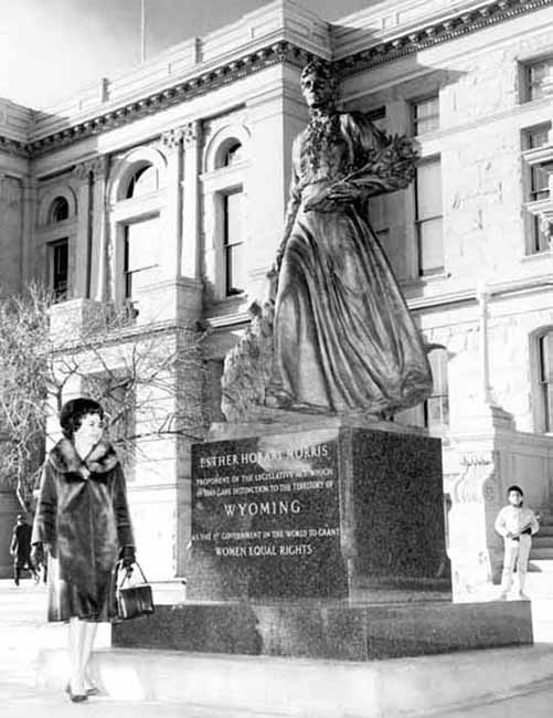 Thyra Thomson admiring statue of Esther Hobart Morris.