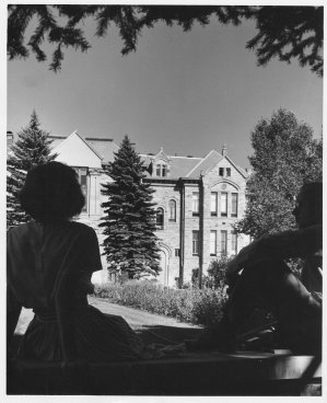 Old Main behind a student couple, no date. 