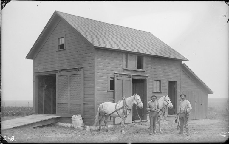 Black and white photograph. Caption reads: "Paul Petzoldt in chimney on Mt. Owen (just for photography)" 