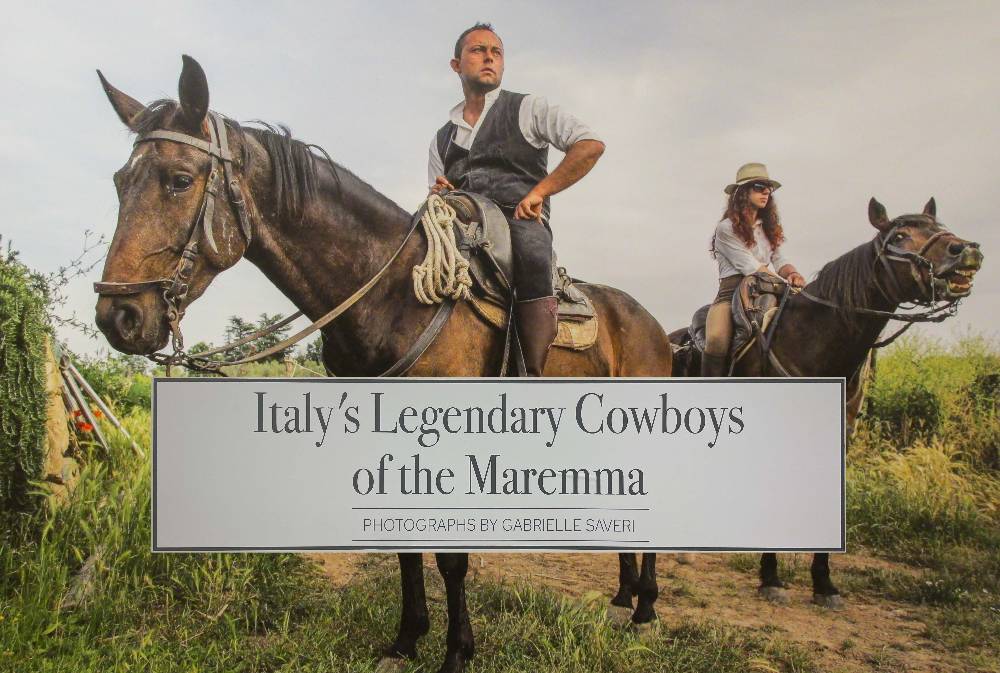 Italian Marema cowboys on hourseback looking majestically into the distance