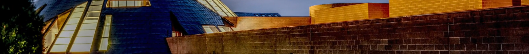 The Centennial Complex dome lit up at dusk