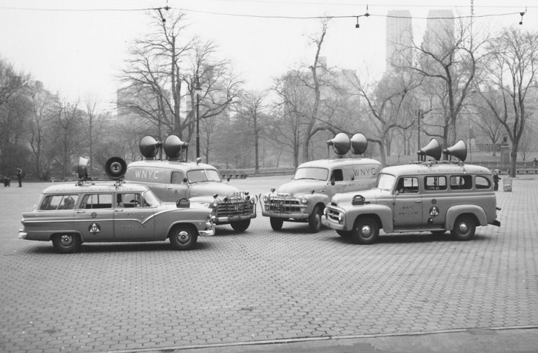 News vehicles clustered together 