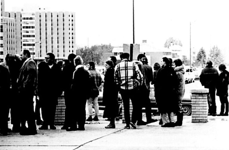 People standing in protest line outside University of Wyoming Residence Halls