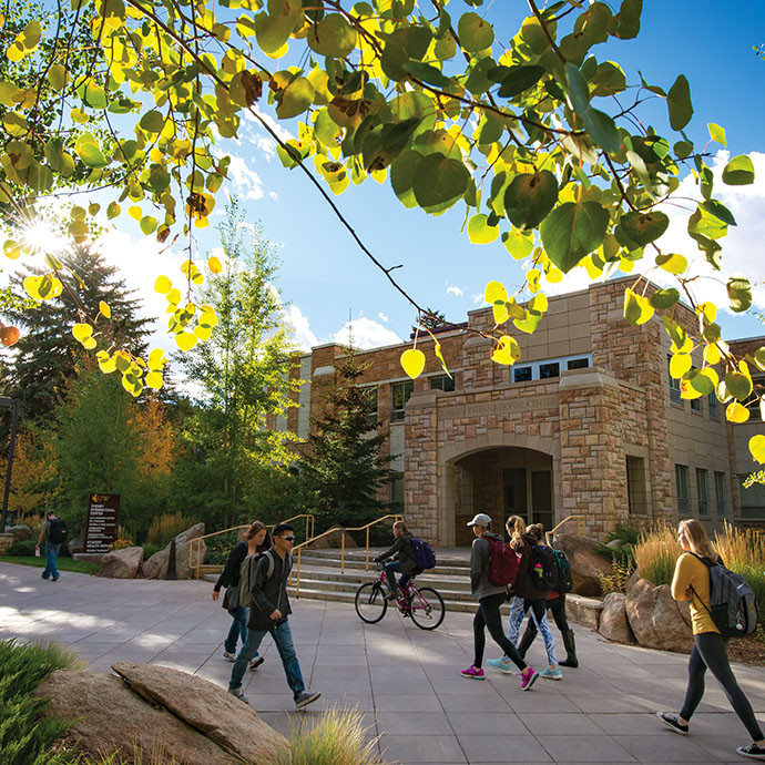 Students walking outside in front of a UW campus building