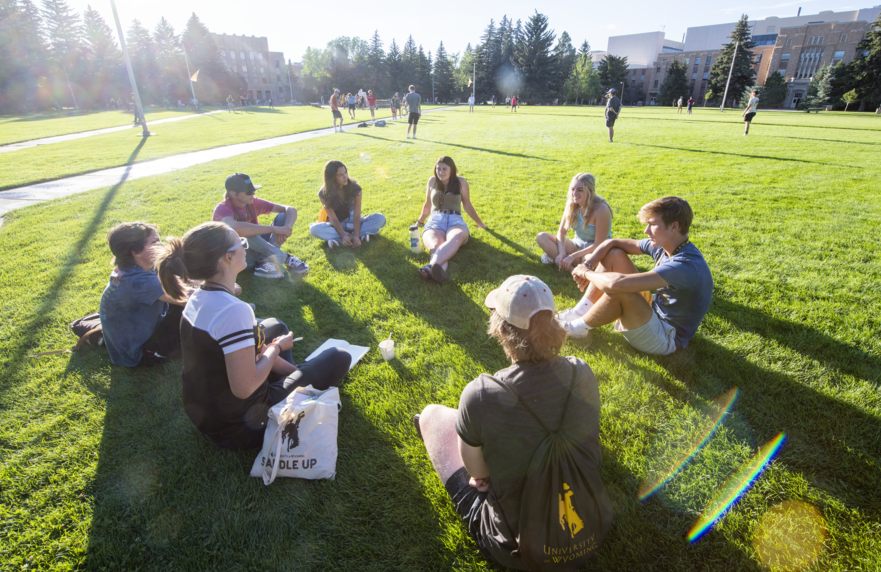 UW students sitting in Prexy's Pasture
