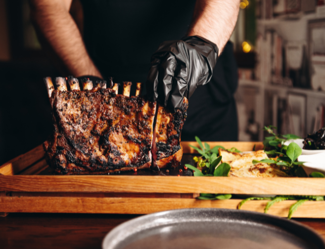 Chef preparing rack of lamb