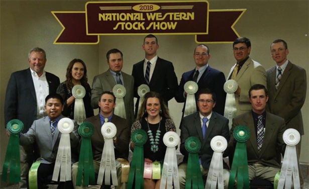 2018 UW Livestock Team poses in front of the back drop at the National Western Stock Show.