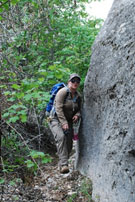 Woker along a rock outcropping.