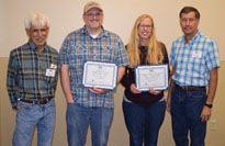 4 workers receiving awards.