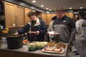 students at a potluck event