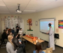 a moroccan student presenting to high School students