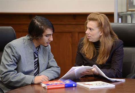 professor anderson sitting with a student