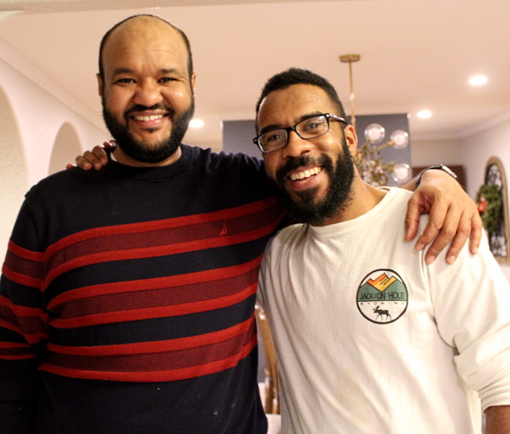 two graduate students smiling 