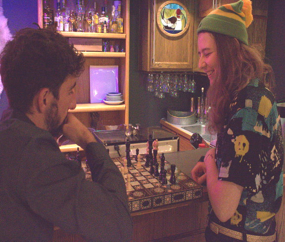 two UW students playing chess at MENA cultural club