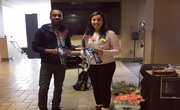 muslim student association students distributing flowers during Islamic Awareness week