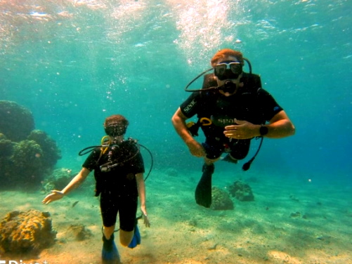 two students scuba diving