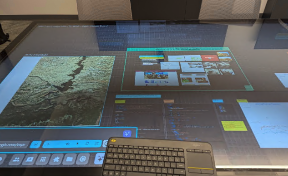 The video touch table showing ARCC’s SAGE3 instance in the Data-X Studio 