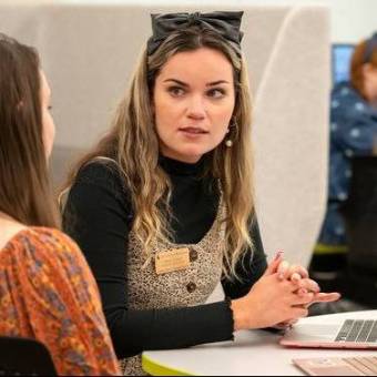 female tutor providing user support