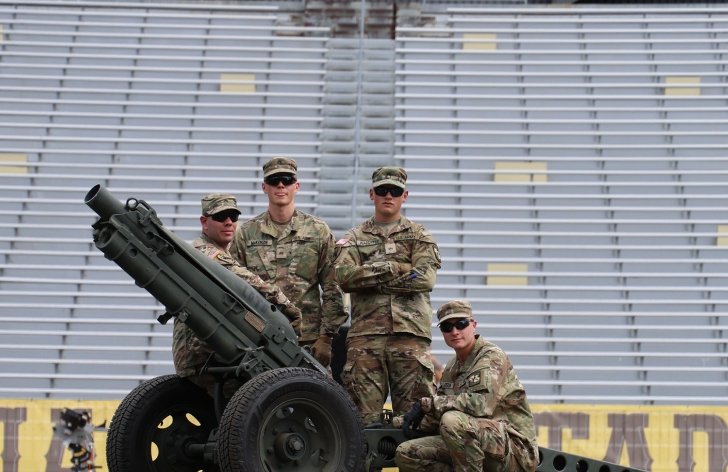 Cadets posing with Cannon on Field