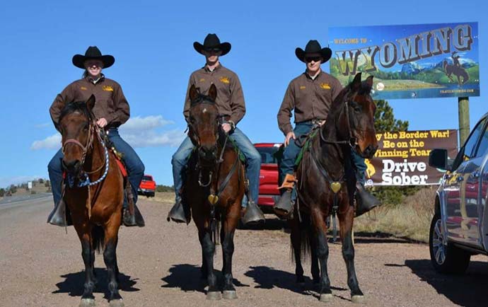 Mounted color guard team on horses by the Wyoming and Colorado border