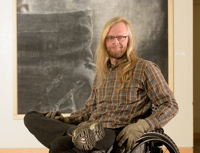 An art student smiles for a photo