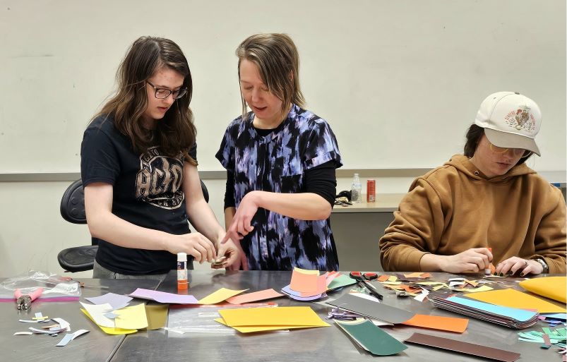 Professor guiding a students in the classroom
