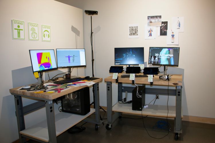 Art Gallery Exhibition with two different interactive computer stations.