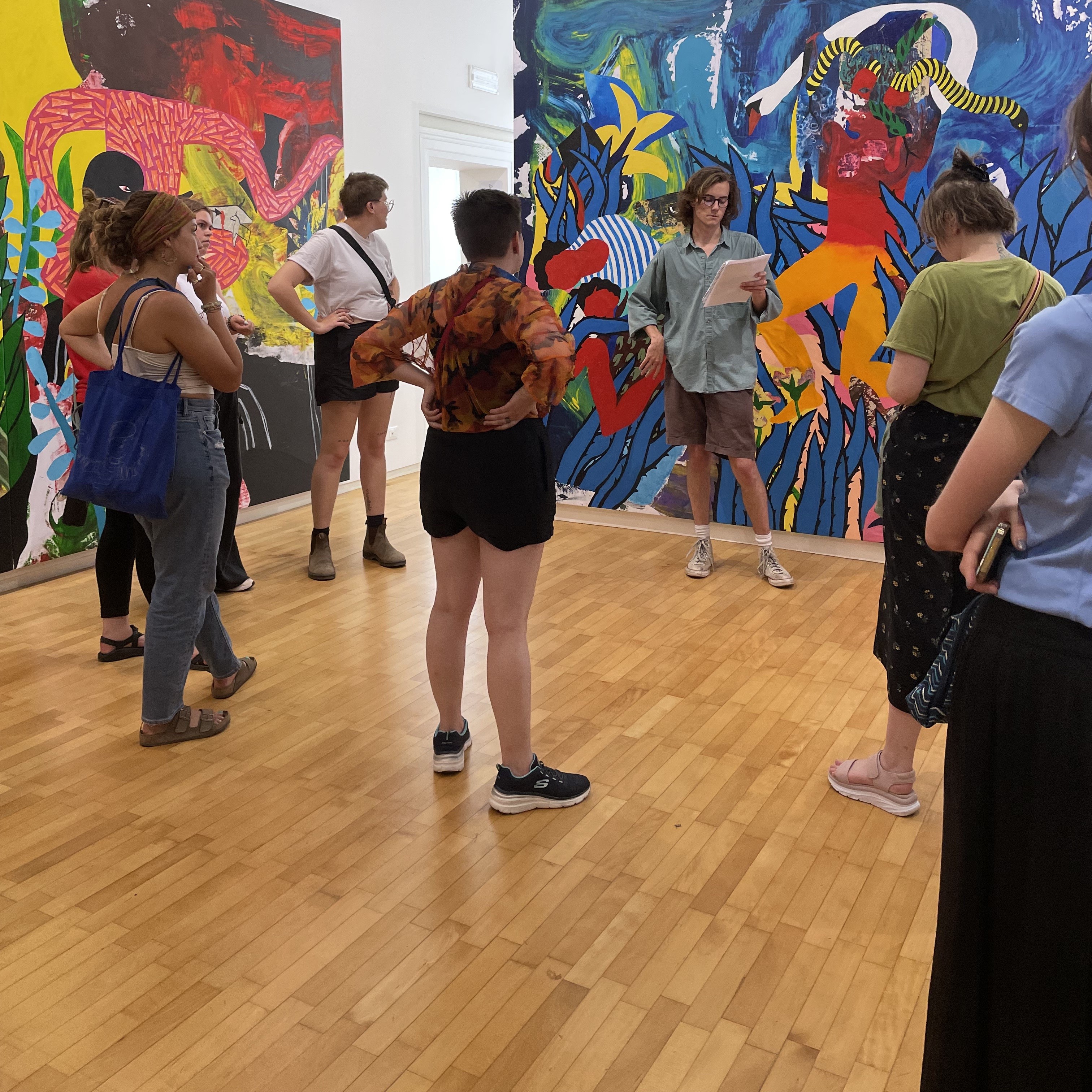 Art students standing in an art gallery